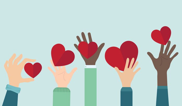 illustration of people's arms being held straight up and holding red cut out hearts - Thanksgiving